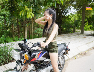 Girl practicing driving a motorbike