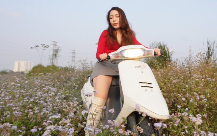 A Girl Playing in a Wildflower Field