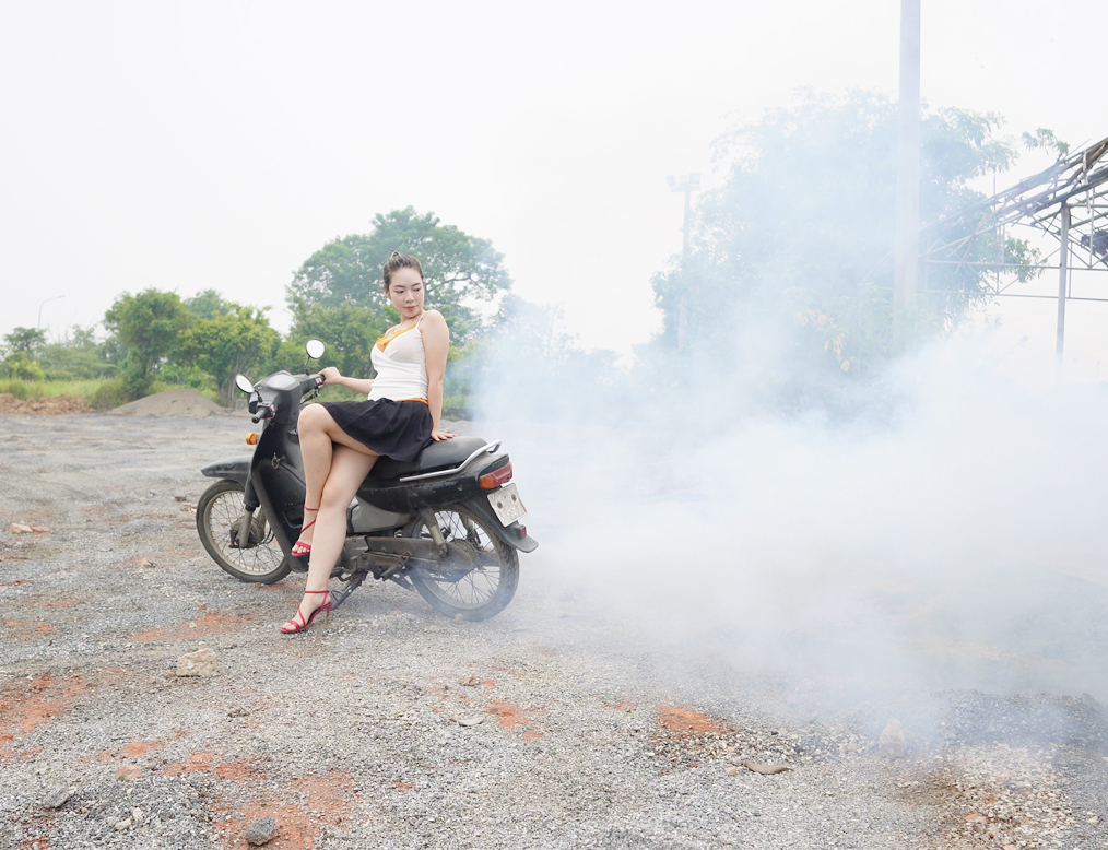 She Revved the Old Motorcycle and Smoke Filled the Air
